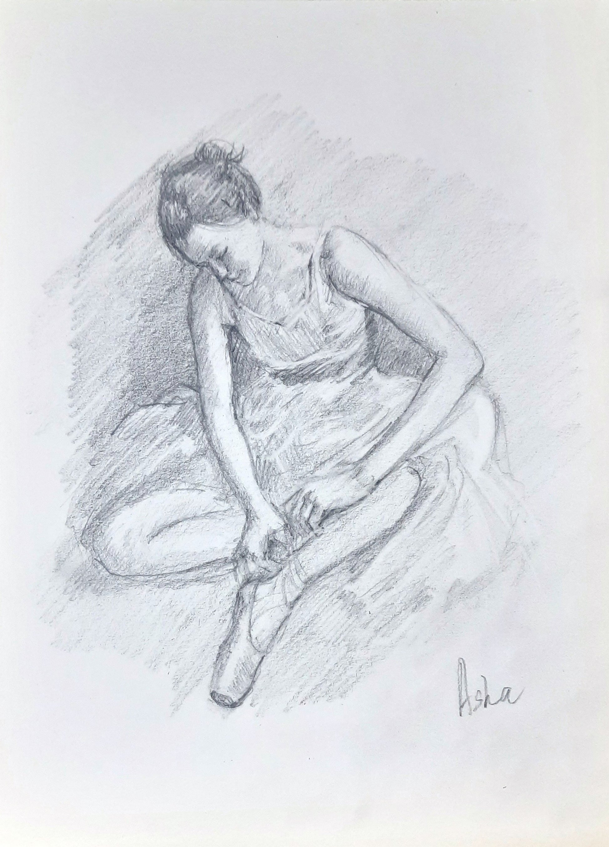 Ballerina adjusting her Pointe