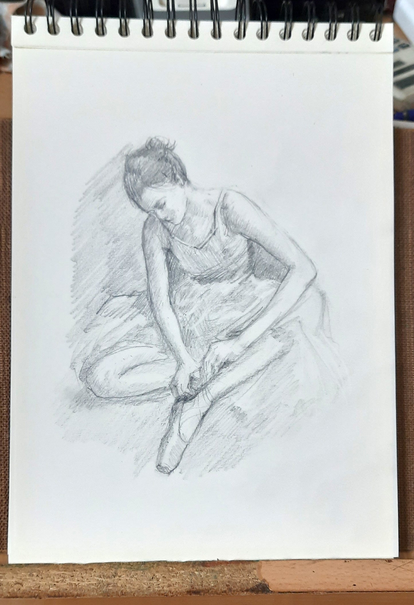 Ballerina adjusting her Pointe work in progress